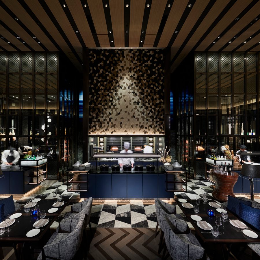 Navy blue interiors of a restaurant at the Four Seasons Hotel Tokyo Otemachi. 