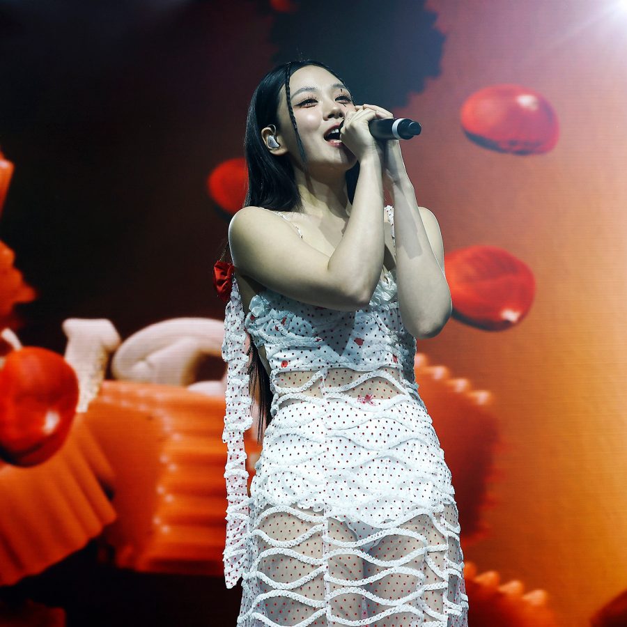 Bibi, who will perform around Asia for her Eve world tour, is seen singing on stage. 