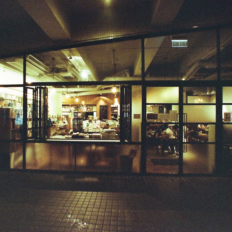 Exterior view at night of Kubrick bookstore.