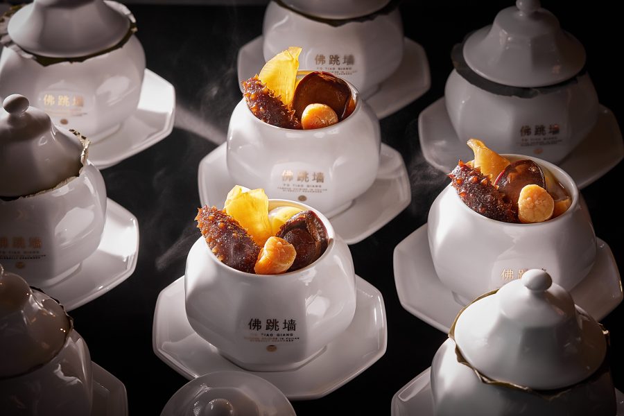 Bowls of Buddha Jumps Over The Wall are placed next to each other at Yanyu, Xiamen.