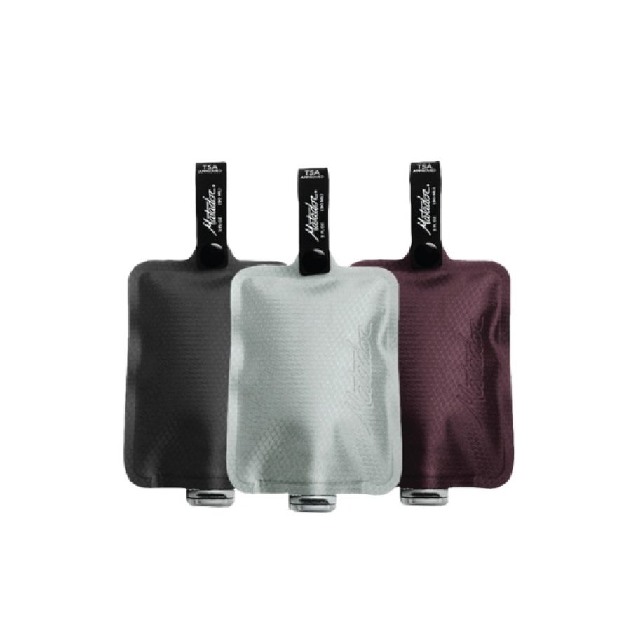 A product shot of Matador’s FlatPak Toiletry Bottle shows three reuseable containers in different colours.