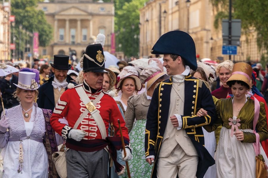 People in Regency costumes at the Jane Austen Festival promenade in Bath.