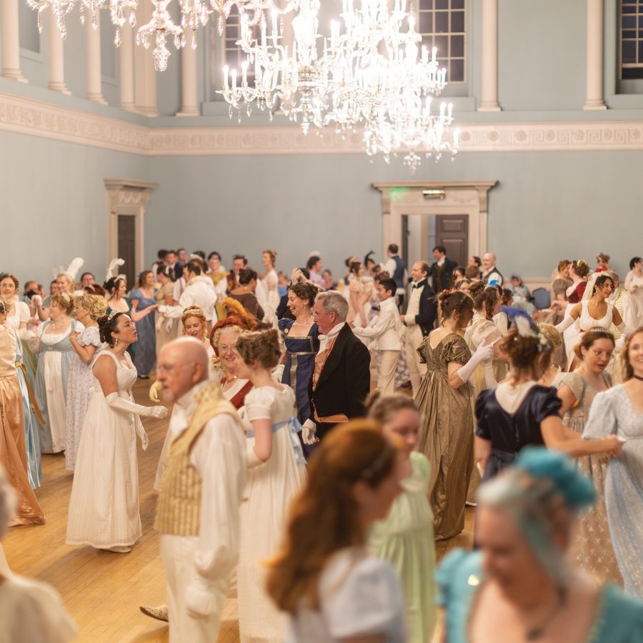 People in Regency costumes at a ball held as part of the Jane Austen Festival