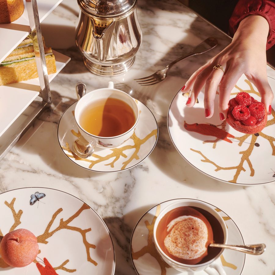 A diner enjoys an afternoon tea set at Le Meurice, Paris.