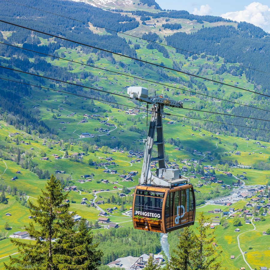 A cable car travels up the mountain at Grindelwald.