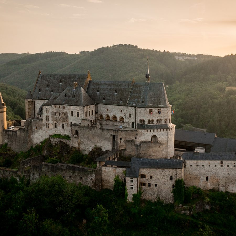 Vianden Castle sits on the ridge of a mountain range in Luxembourg.