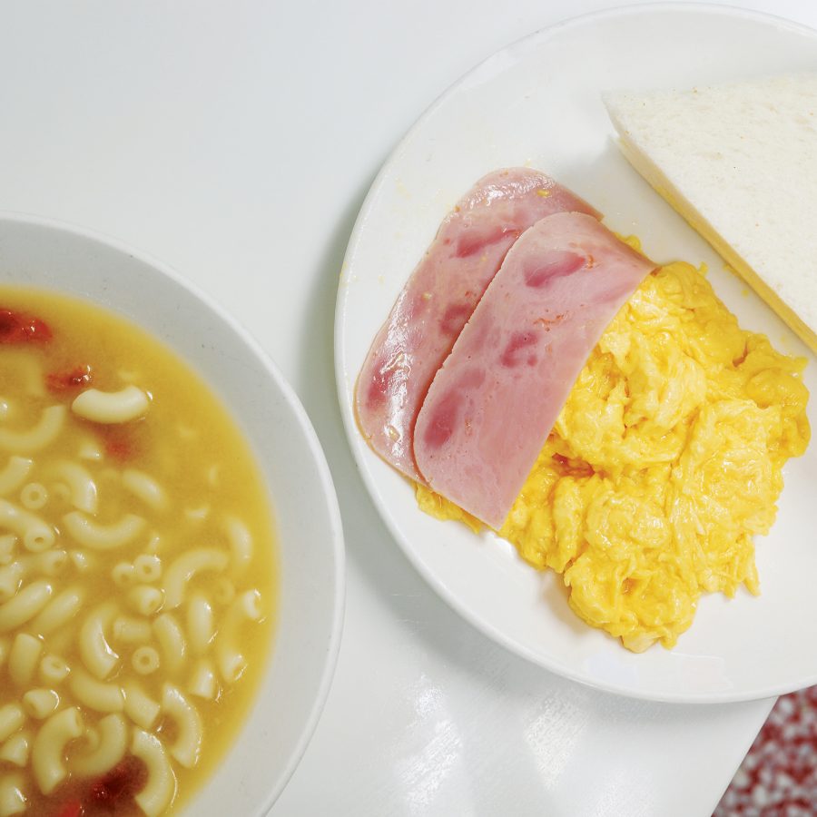 Close up of a soup macaroni dish and spam and scrambled eggs at a Hong Kong cafe.