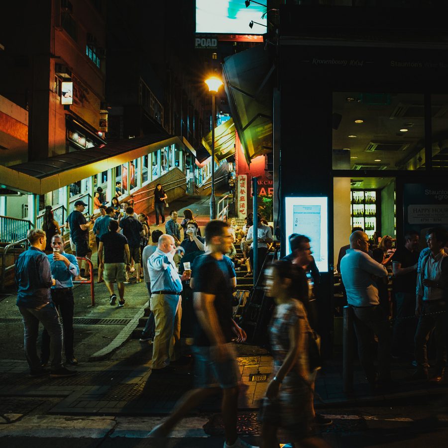People gathered outside a bar in Soho in Hong Kong.