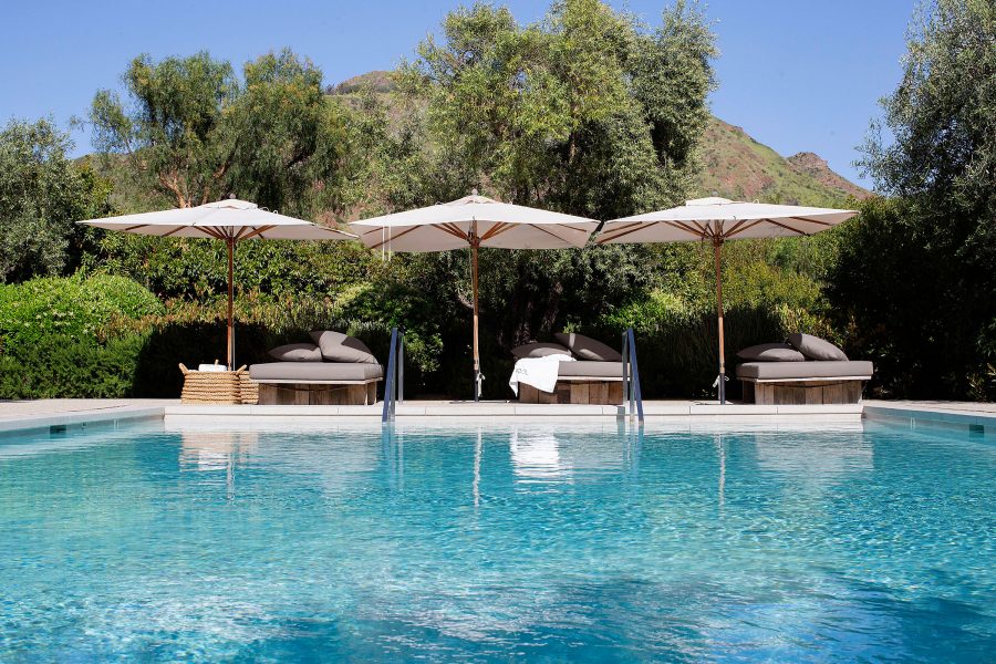 View of sun loungers by a swimming pool at The Ranch Malibu  