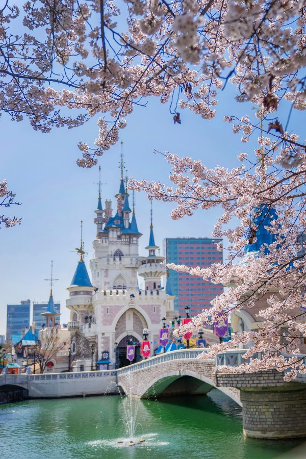 A view of a castle, stone bridge and river at Lotte World Adventure in Seoul, South Korea 