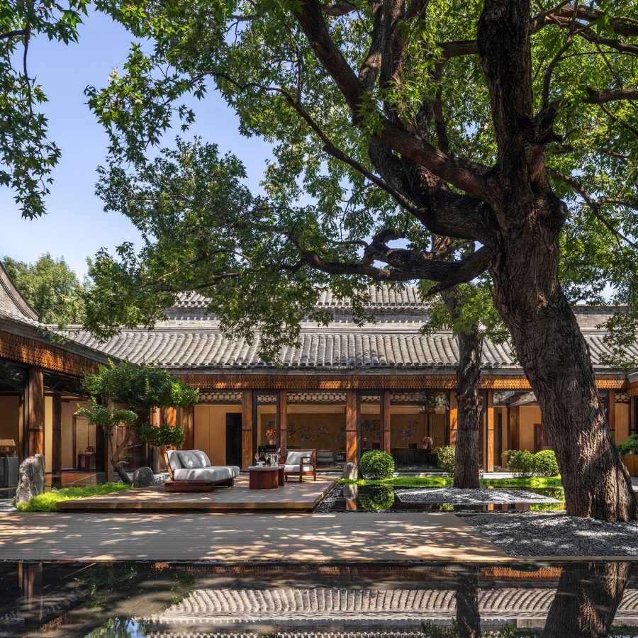 A ciew of the traditional courtyard with a tree towering the building at Mandarin Oriental Qianmen in Beijing, China