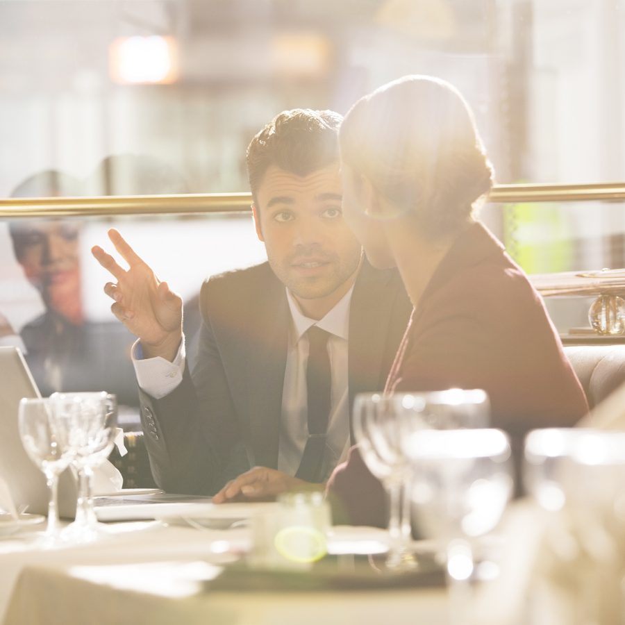 Smart-dressed businesspeople meeting at a Paris restaurant  