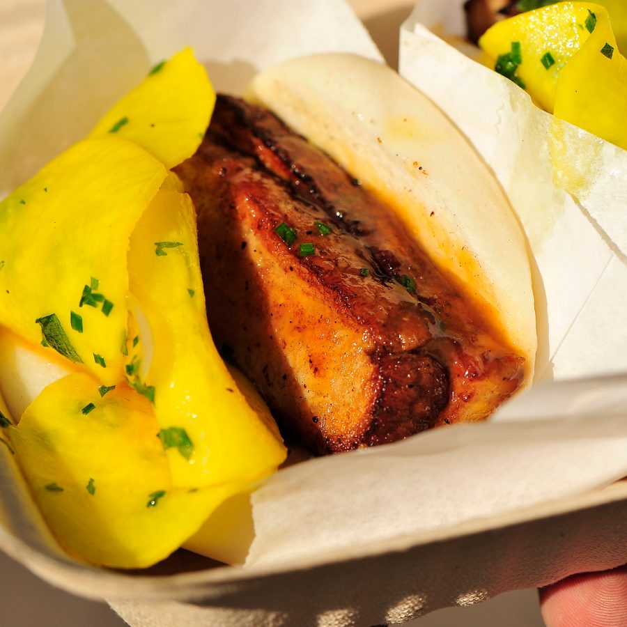 A closeup of a braised pork belly bao, served at The Chairman in San Francisco