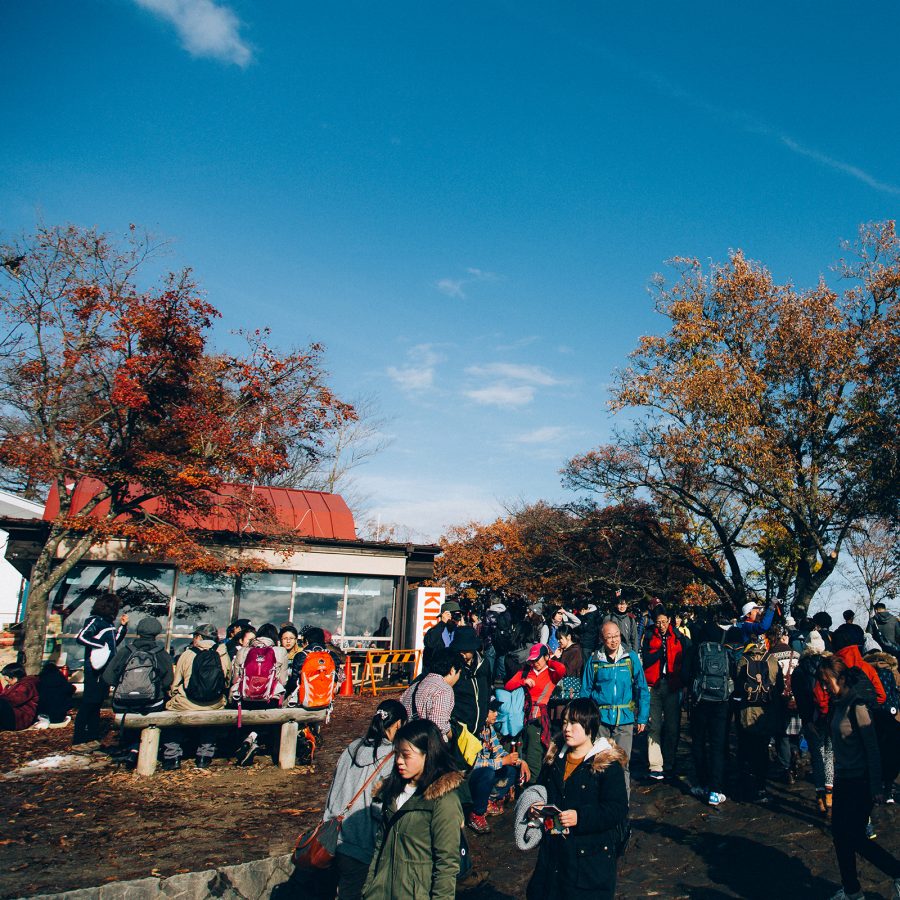 Hikers gather at Mount Takao in Tokyo to hike up the mountain and see the autumn leaves.