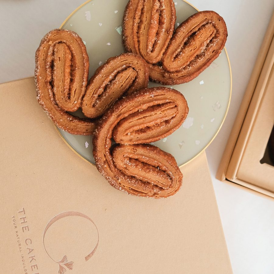 Palmier biscuits from The Cakery on a saucer.