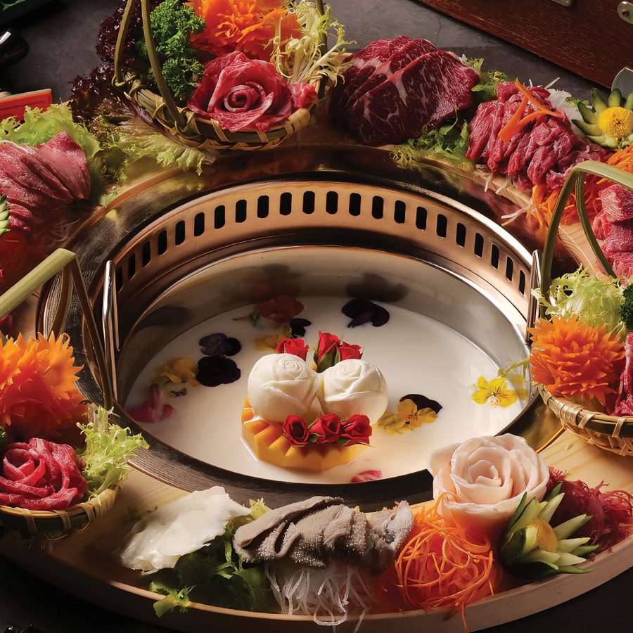 A hotpot set-up with meat and vegetables at Victorian Era, Hong Kong.