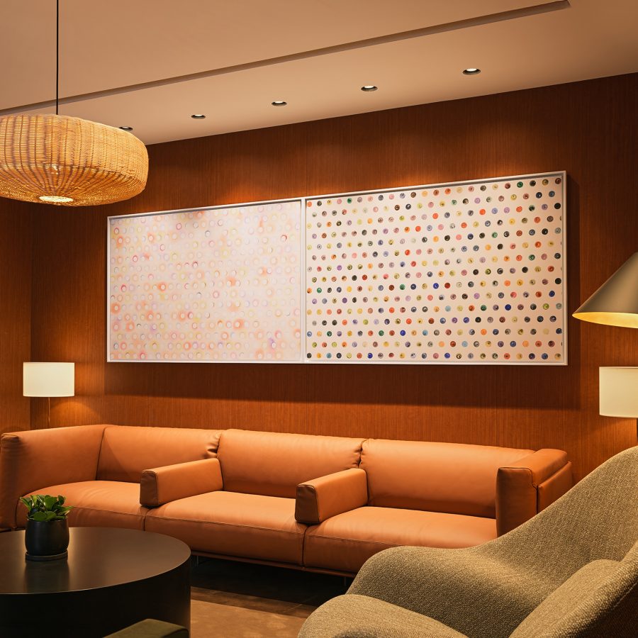 Zhang Yanzi’s “The Genetic Lottery” hanging above a sofa at Cathay Pacific’s Beijing lounge.