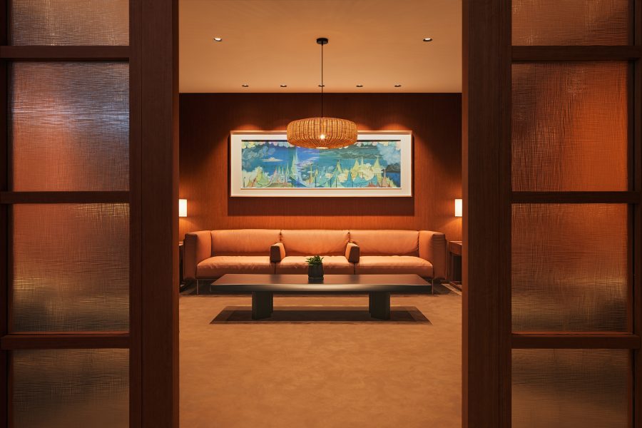 Xu Lei’s “World Cloud” hanging above a sofa in an enclosed area at Cathay Pacific’s Beijing lounge.
