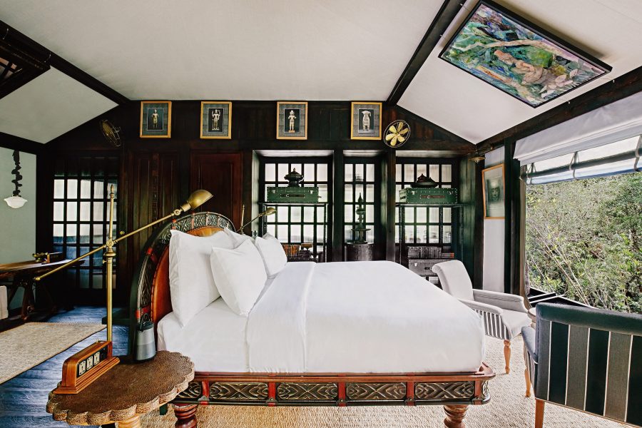  Interior of a bedroom at Shinta Mani Wild, Cambodia, with a view of the jungle outside. 