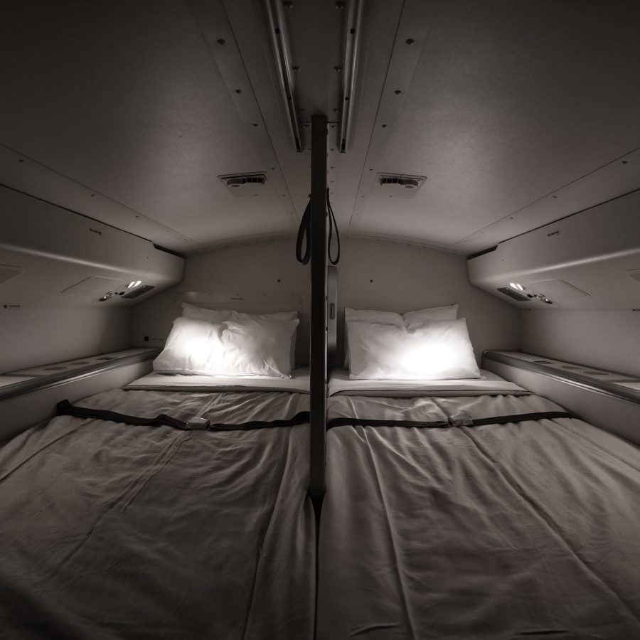 Two bunk beds with pillows in the pilot rest area on board Cathay Pacific aircraft.