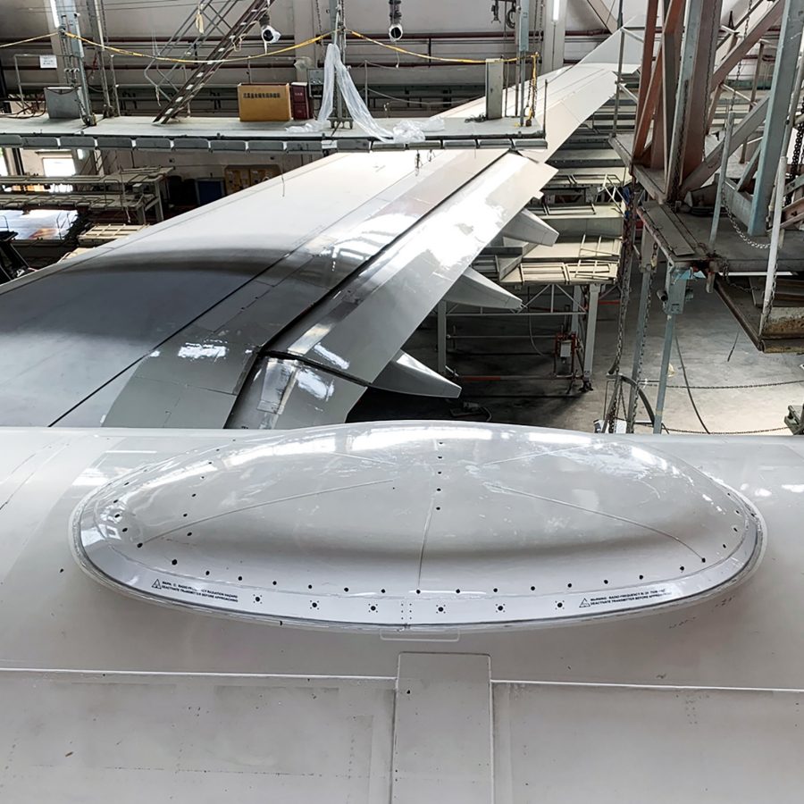 A view of a plane wing with a new addition to enable inflight Wi-Fi