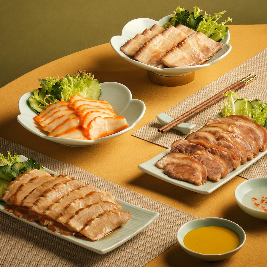 Various dishes from Hung’s Delicacies laid out on dishes. 