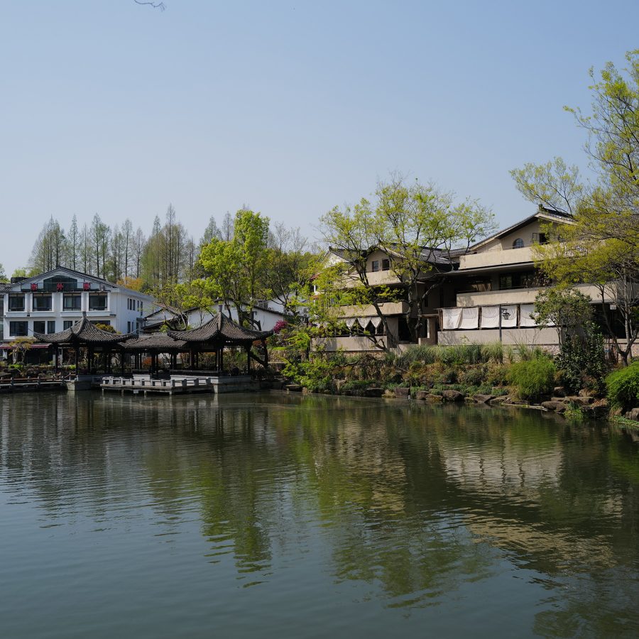 Exterior view of Pu Shu restaurant, with water in the foreground.
