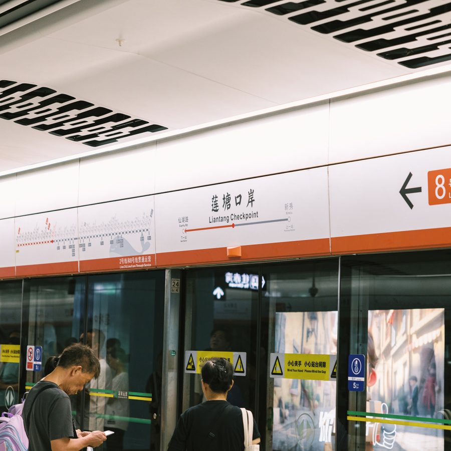 People waiting for the train on the platform at Shenzhen Metro Line
