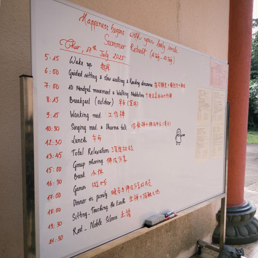 A whiteboard with the rundown of the wellness retreat activities.