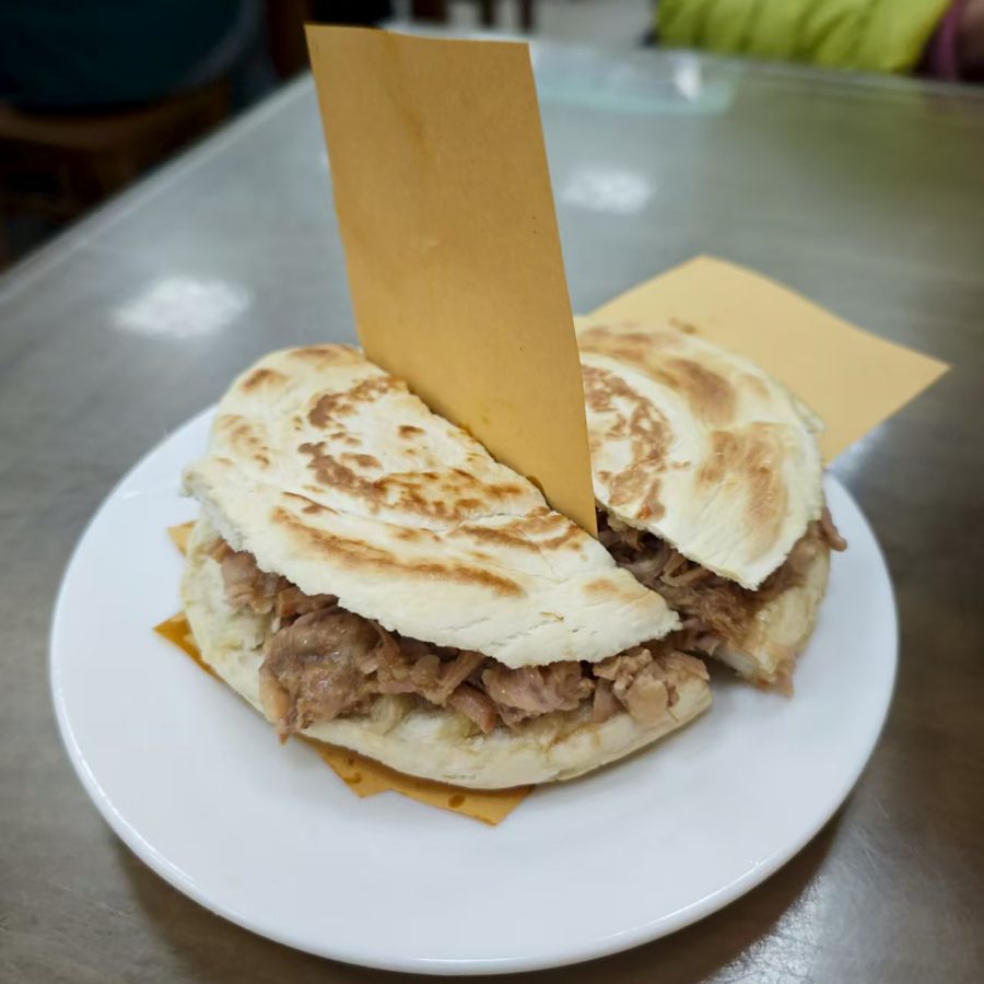 A roujiaomo flatbread dish filled with meat.