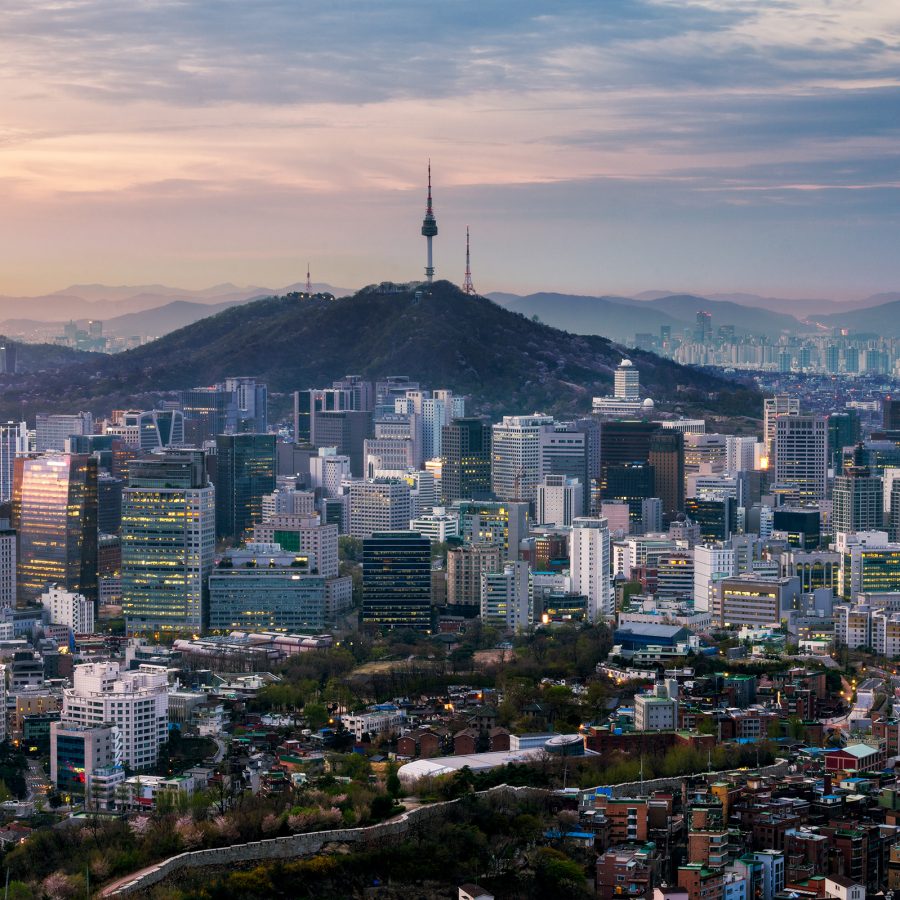 Seoul’s skyline at dusk, with Namsan Park and N Seoul Tower in the distance. 