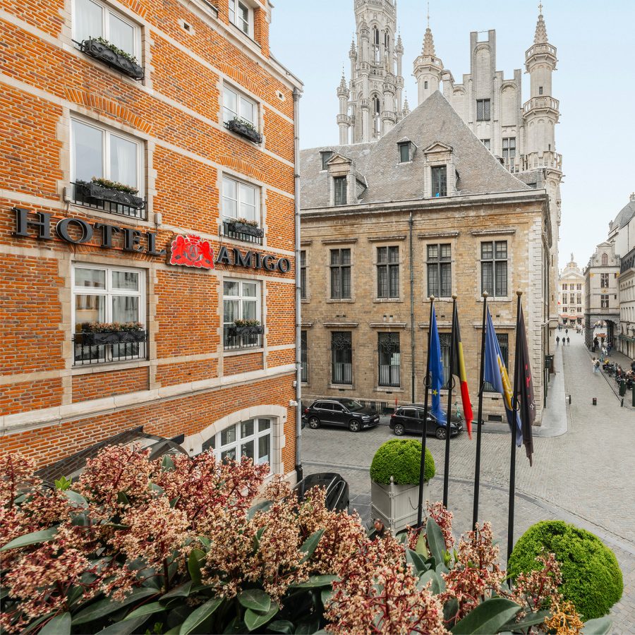 A street view of Rocco Forte Hotel Amigo on a clear day.