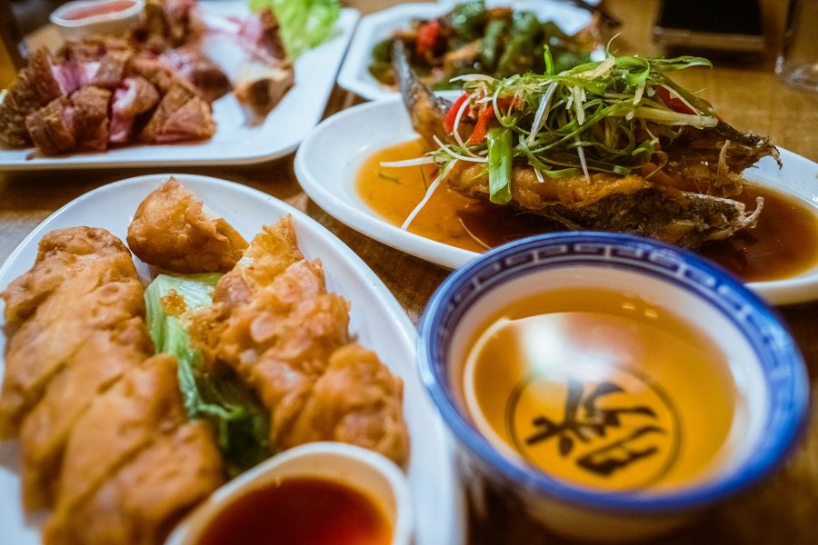 A spread of dishes at Mui Kee includes crispy flour dough stuffed with shrimp, fried fish and fried pork knuckle. 