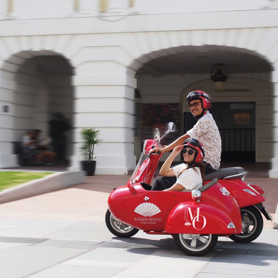 Travellers experience the Vesca sidecar tour available at Mandarin Oriental, Singapore.