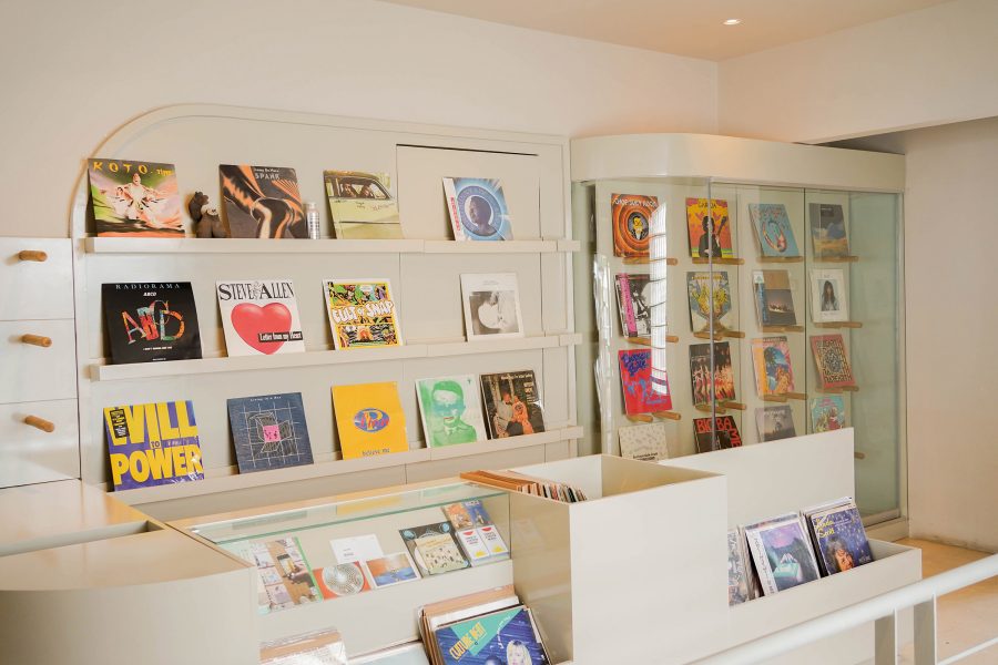 A wall has been decorated with shelves of records at Peel’s Records.