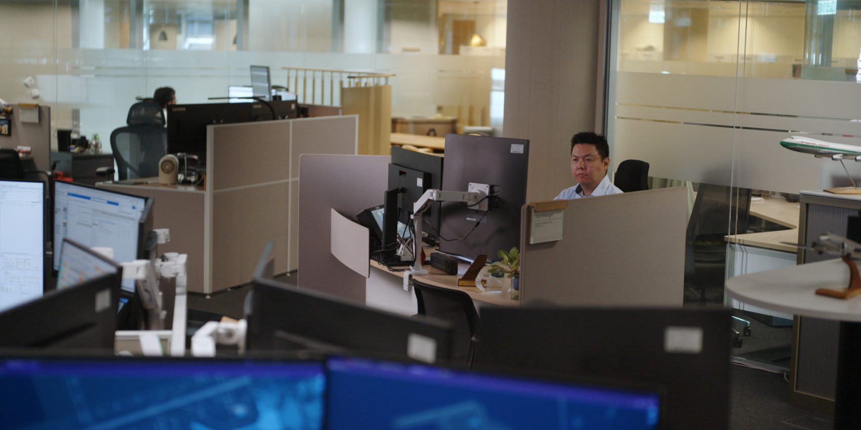 A person sitting in the Cathay Integrated Operations Centre monitoring the typhoon