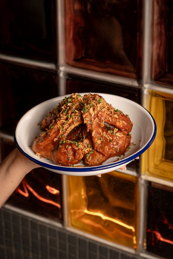 A person holds up a dish at AER.