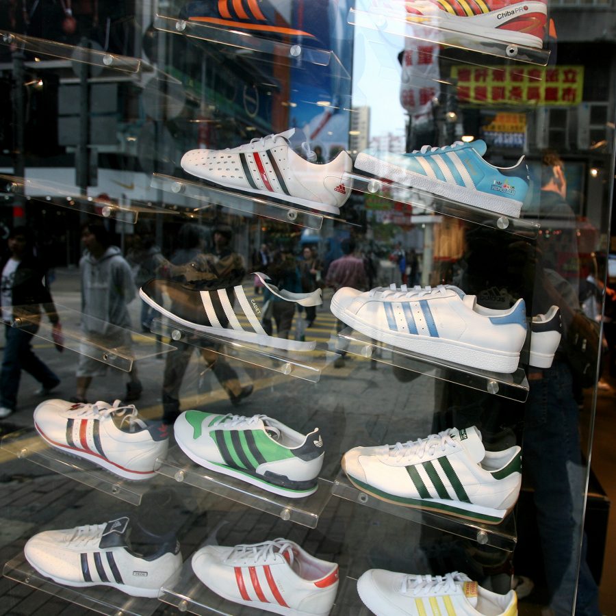 A display of sneakers seen through a shop window at Sneakers Street in Mong Kong, Hong Kong