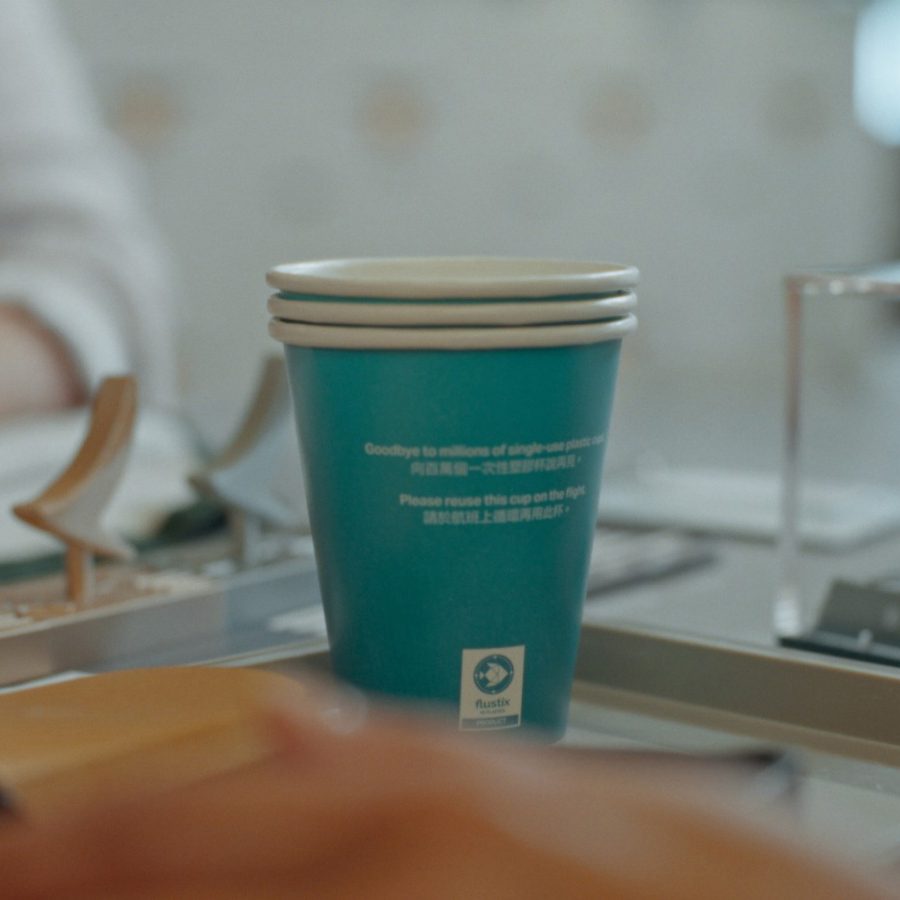 A stack of paper cups on a tray.