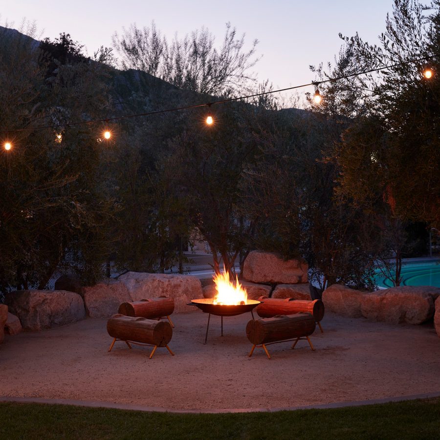 A firepit at Ace Hotel & Swim Club, Palm Springs, at dusk.