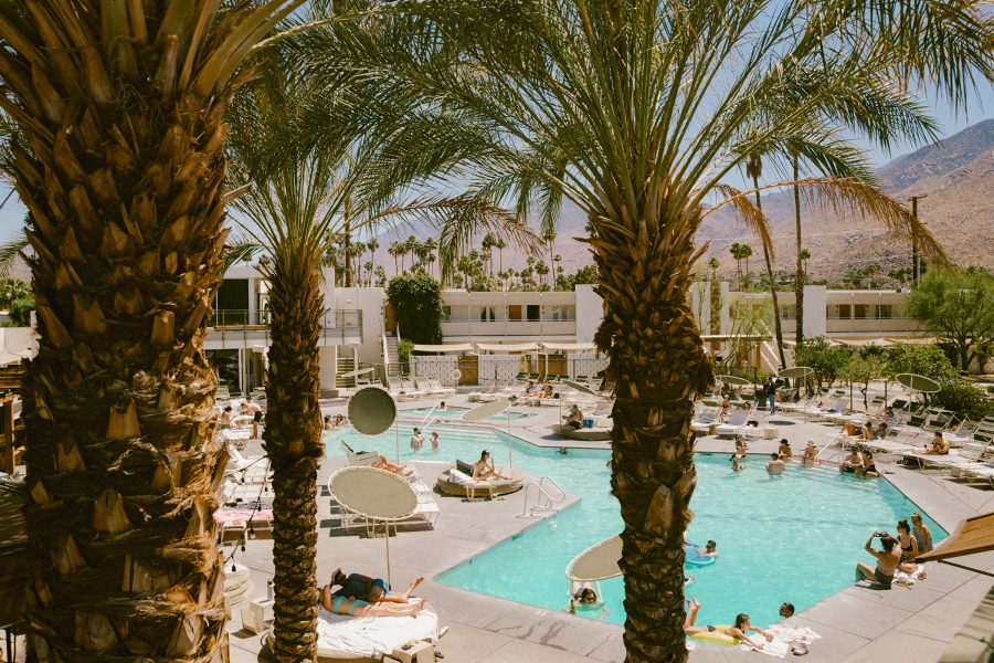 People enjoying the pool in the daytime at Ace Hotel & Swim Club, Palm Springs.