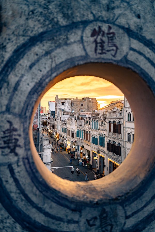 View of the old city in Haikou through a circular window.