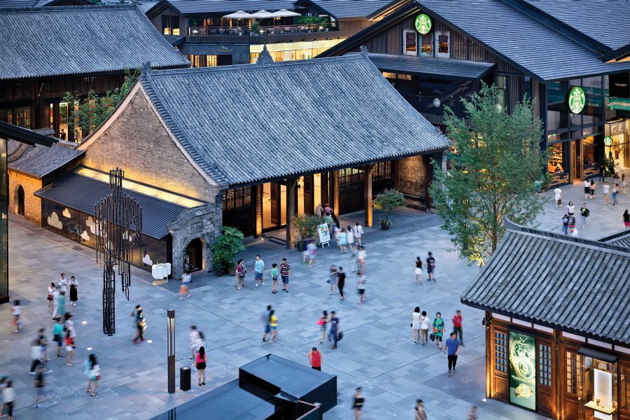 View of crowds walking through a stylish shopping district in Chengdu.