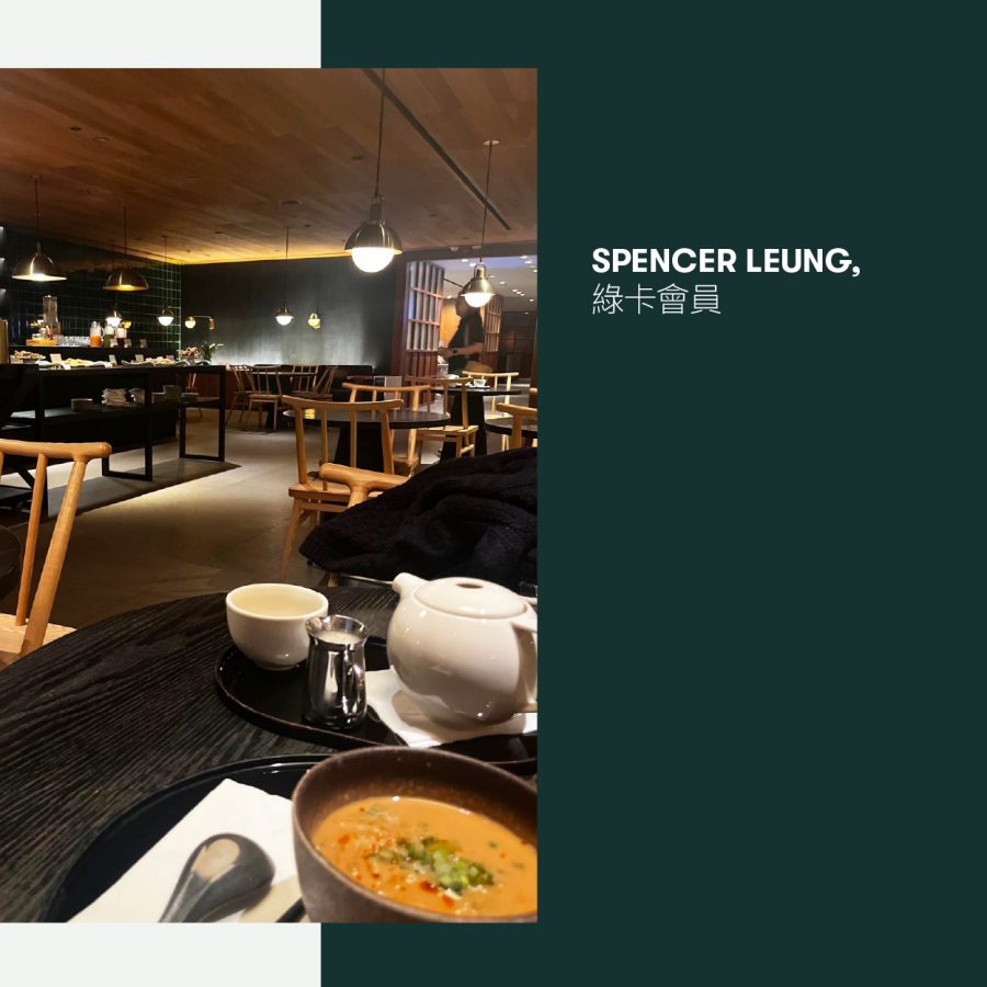A bowl of dan dan noodles on a dark wooden table at Cathay Pacific’s The Pier, First lounge at Hong Kong International Airport.