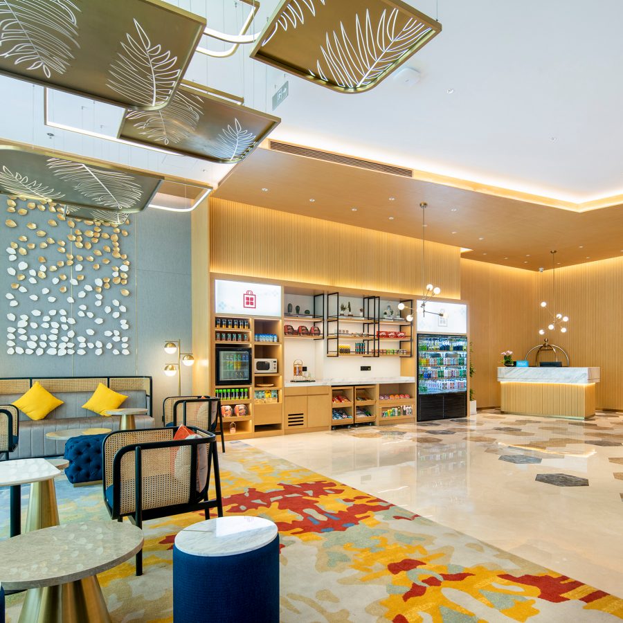 The lobby and reception area of Hilton Garden Inn in Shenzhen has a convenience store.