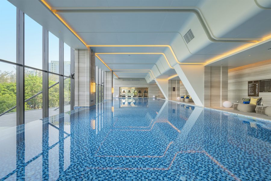 An indoor pool at DoubleTree by Hilton in Shenzhen looks outside. 