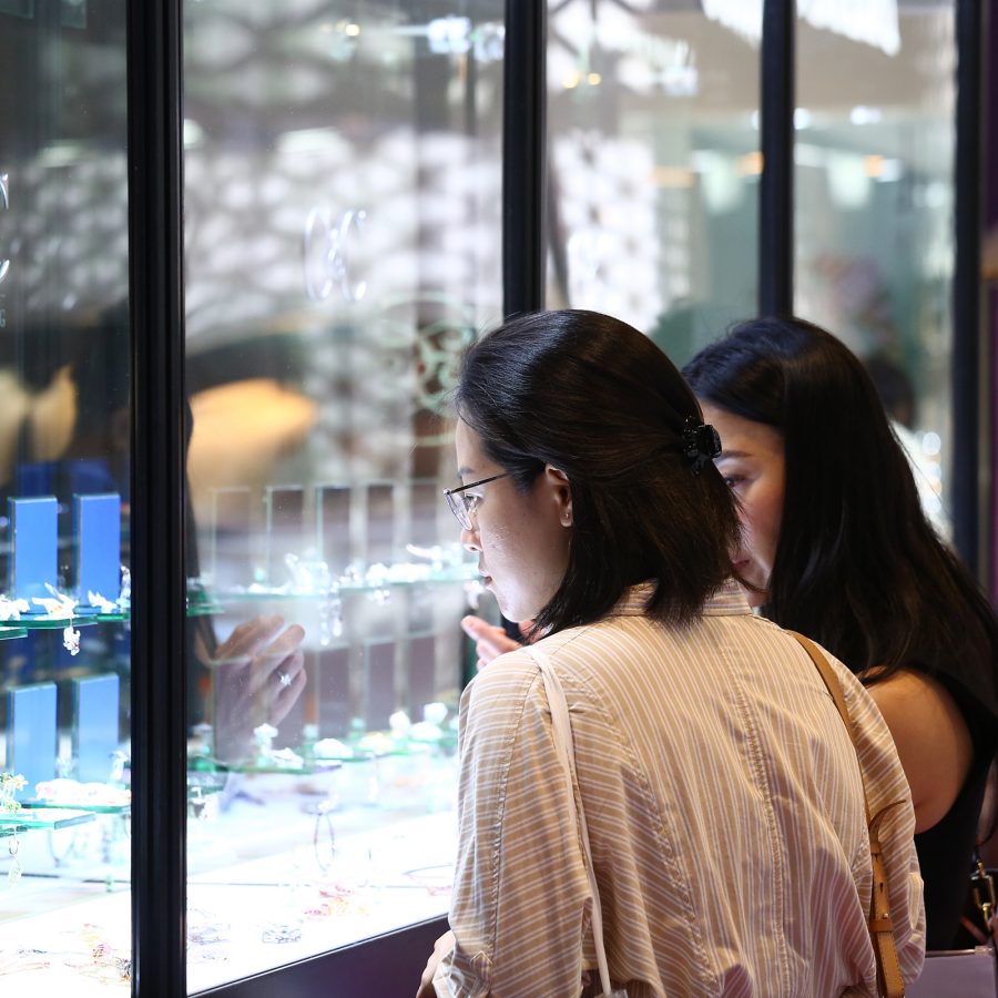 Women browse displays at the Hong Kong Jewellery and Gem Fair