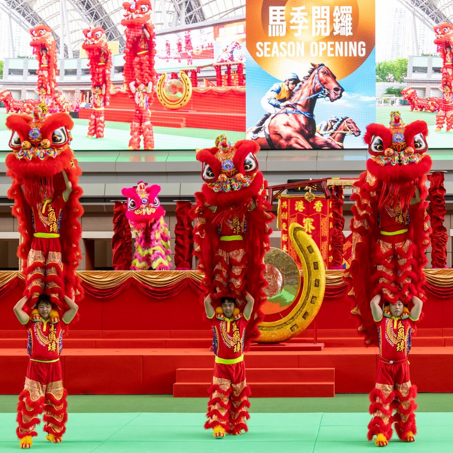Lion dancers perform at the Hong Kong season opening of the horse races