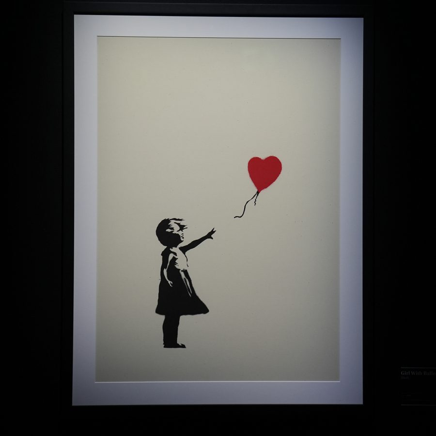 Girl with Balloon, a work by Banksy soon to be exhibited at Shenzhen, is seen hanging on a wall.