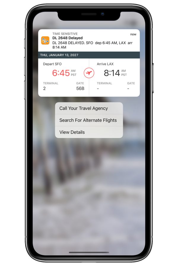A smartphone image TripIt travel planning app and travel information and schedule on the screen.